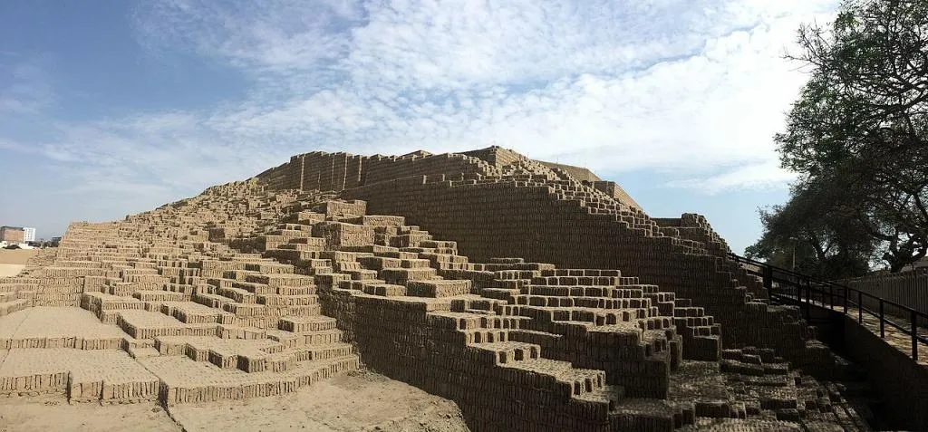 Pre-Inca pyramid of Huaca Pucllana with modern city background